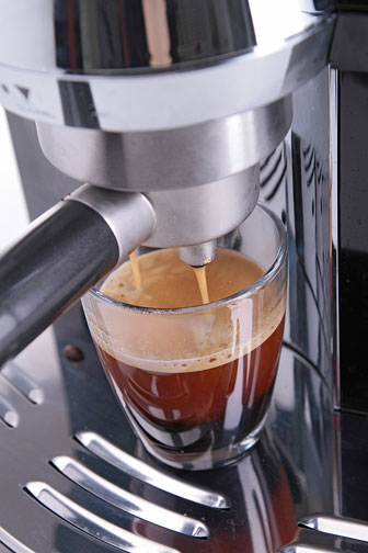 espresso maker brewing a shot of espresso