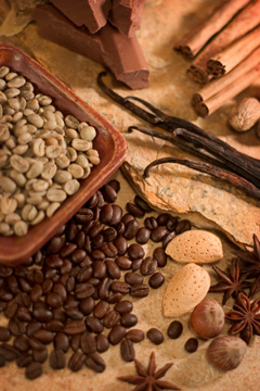 green and roasted coffee beans with chocolate, cinnamon, vanilla, almonds, hazelnuts, nutmeg, and anise seed flavorings