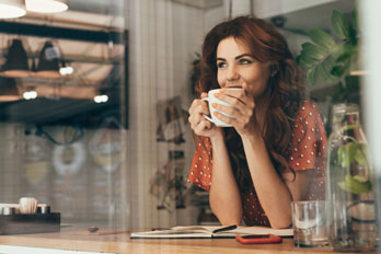 woman enjoying a cup of coffee